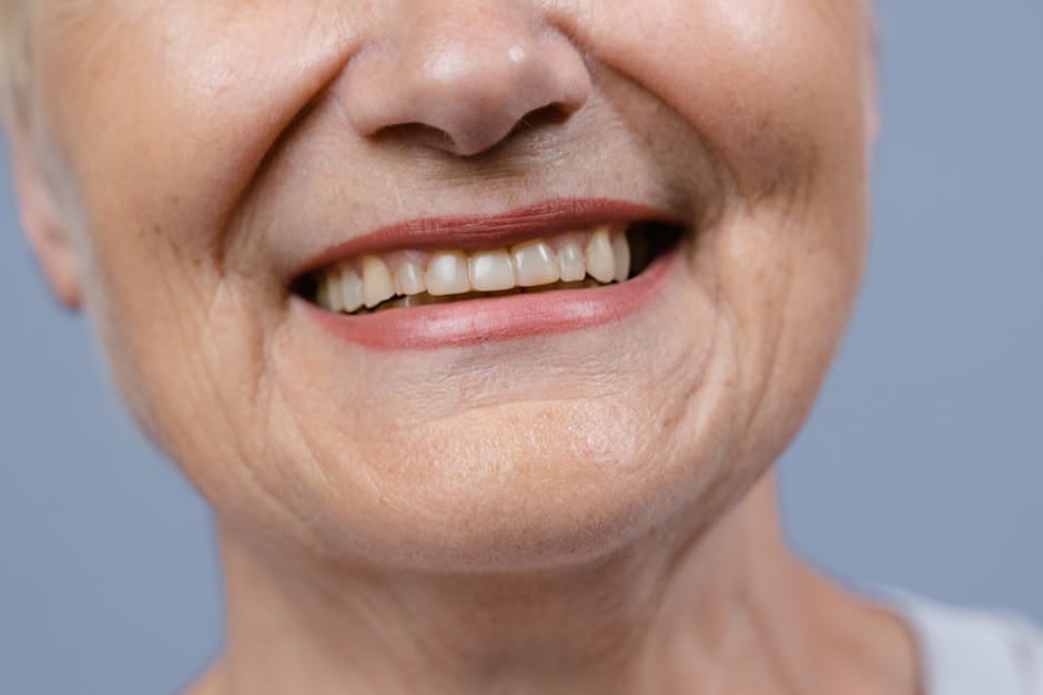 Senior woman smiling showcasing natural teeth