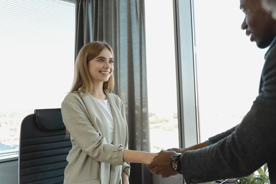 Woman smiling confidently at a business meeting